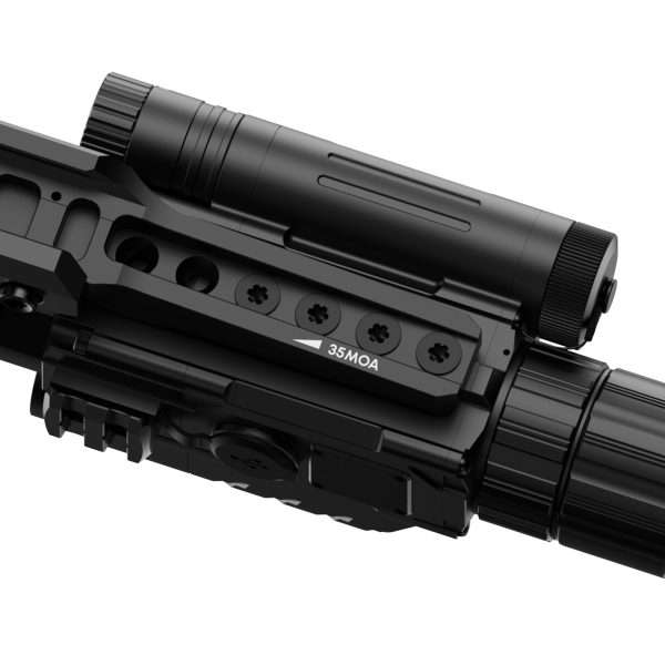 Close-up of a black rifle scope mounted on a rail, with a 35MOA marking visible on the mount.